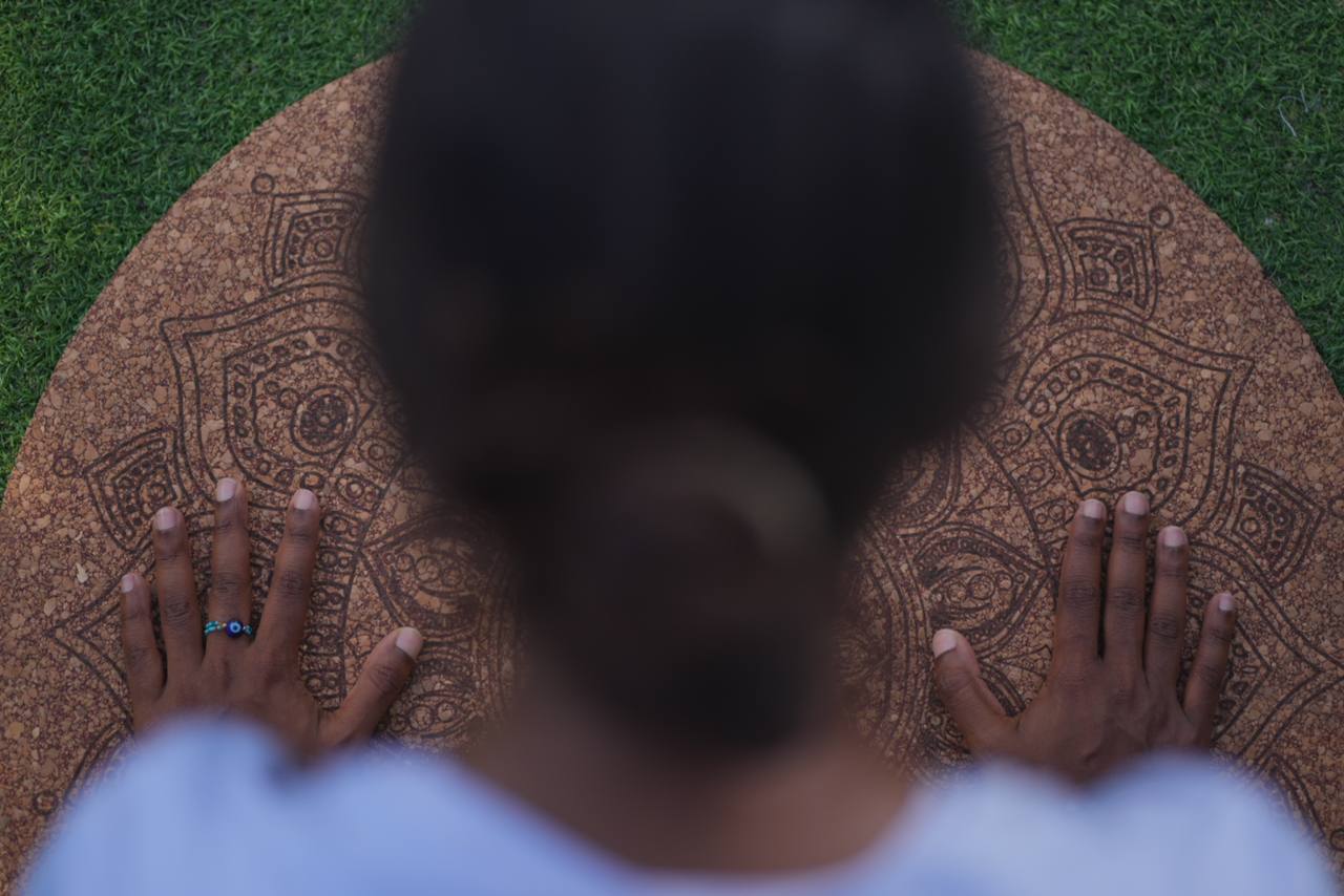 Overhead view of Zey on her cork mandala mat